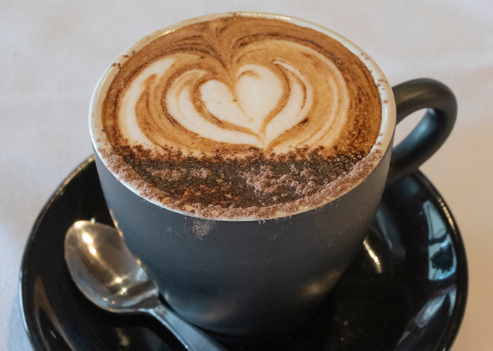 A mug full of coffee. 