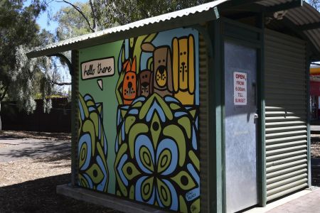 A toilet block with a mural at Denis Morrissey Park