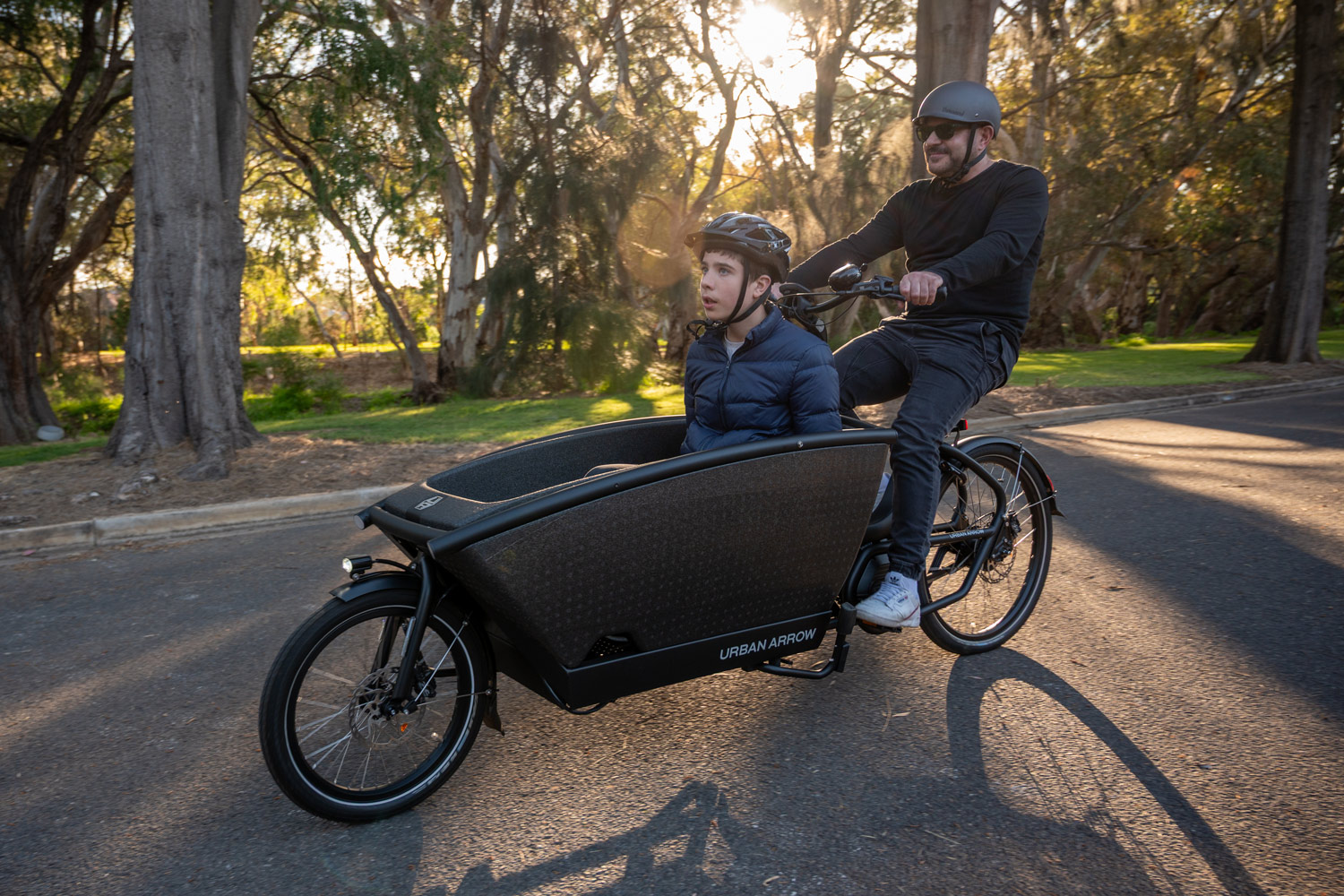 A man riding a cargo bike.