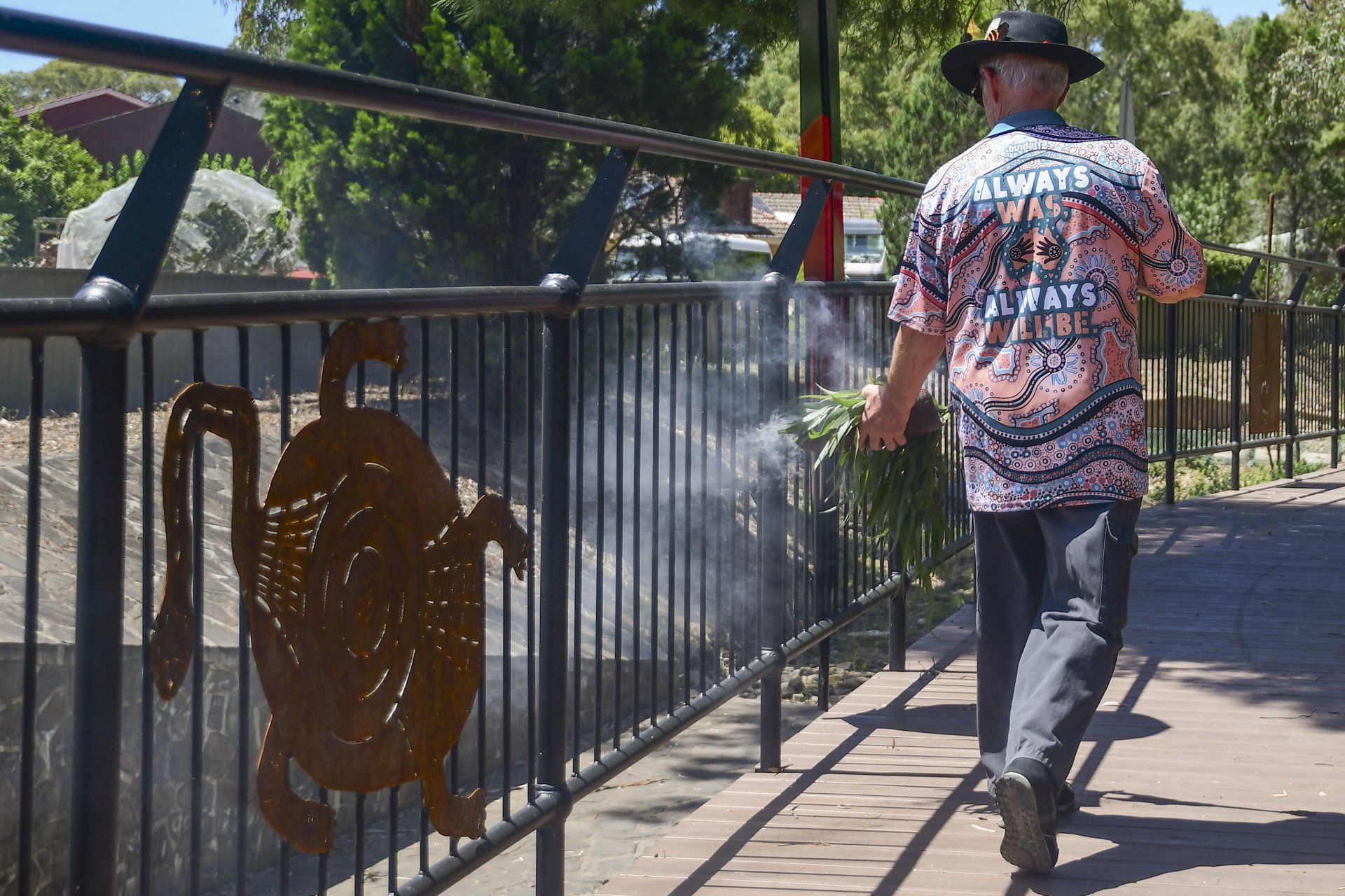Kaurna and Peramangk Elder Uncle Ivan-Tiwu Copley performing a smoking ceremony at the Fourth Creek Morialta Parri Trail Project Launch
