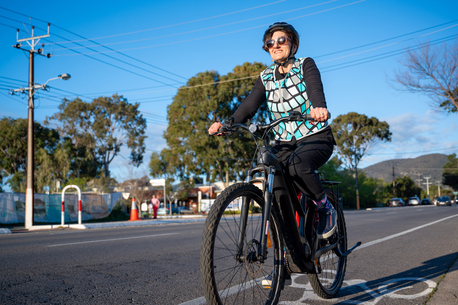 A woman riding an e-bike.