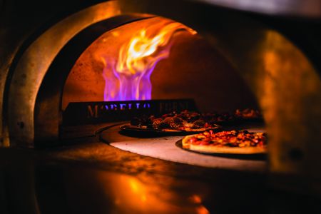 A pizza in a pizza oven.