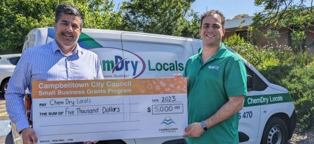 Council CEO, Paul Di Iulio, handing a jumbo cheque to Chem-Dry Locals