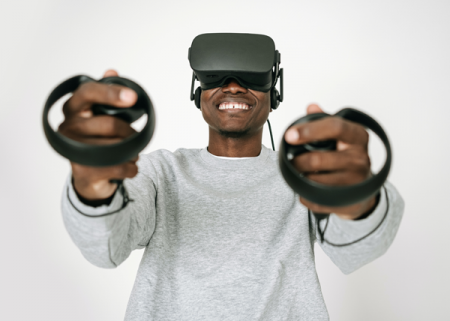 Photograph of a man wearing a virtual reality headset.