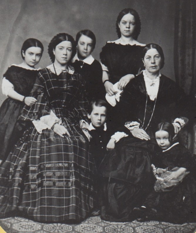 Mrs. Anna Hawkins (seated right) and her children in 1864. Mrs. Anna Hawkins (seated right) and her children in 1864.