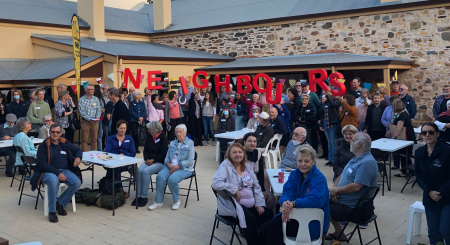 Neighbours enjoying a BBQ together on Neighbour Day.
