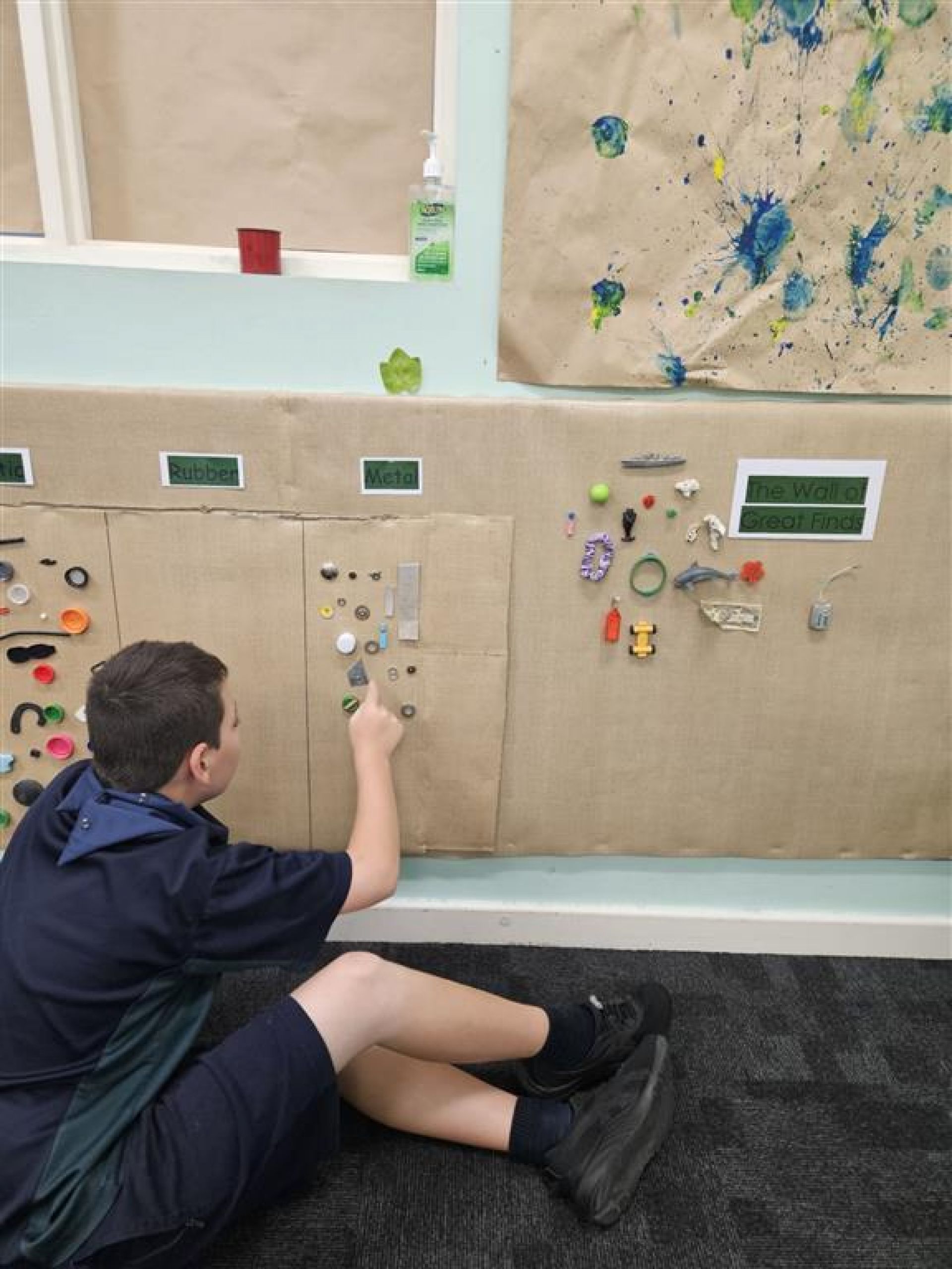 Jayden's wall of items he has collected and sorted for a school project.