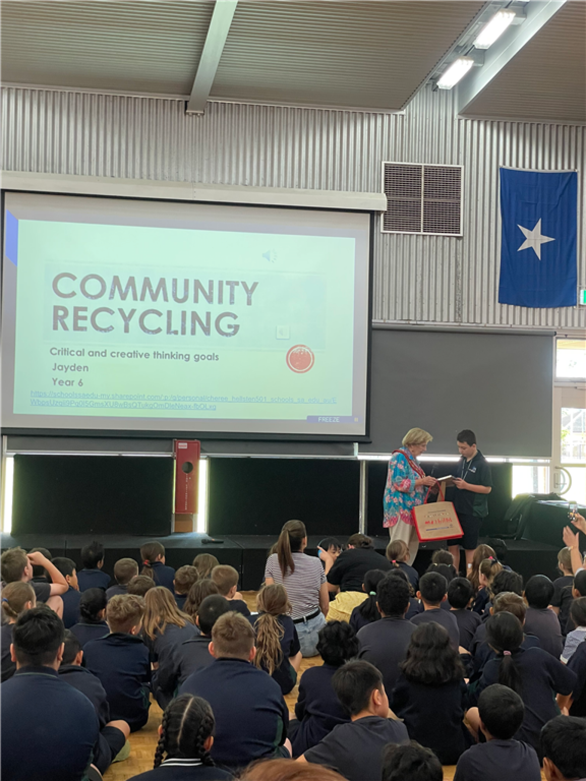 Jayden being presented with an award at his school assembly.
