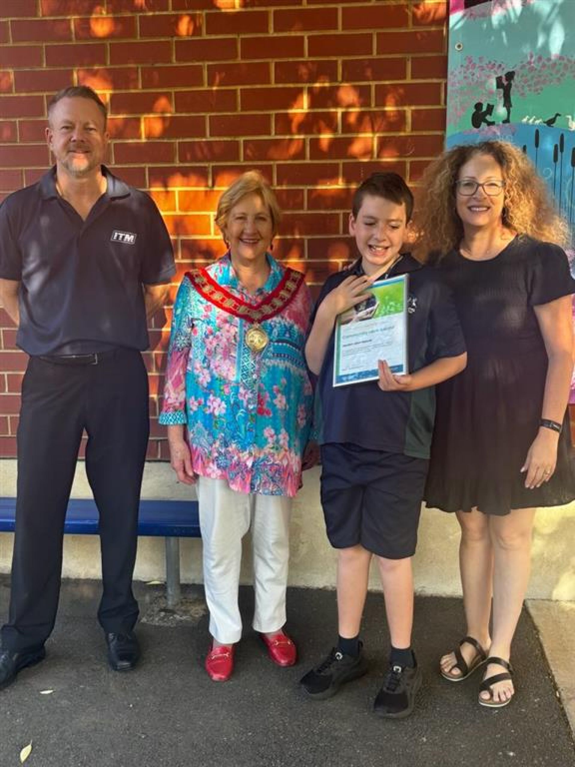 Jayden with his proud parents and Mayor Jill Whittaker OAM.